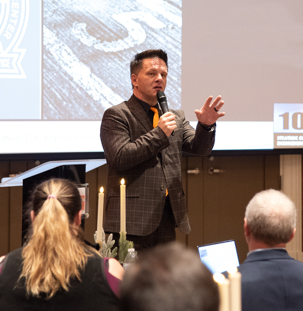 Training Specialist Jeff Hundley speaks in front of a seated audience.