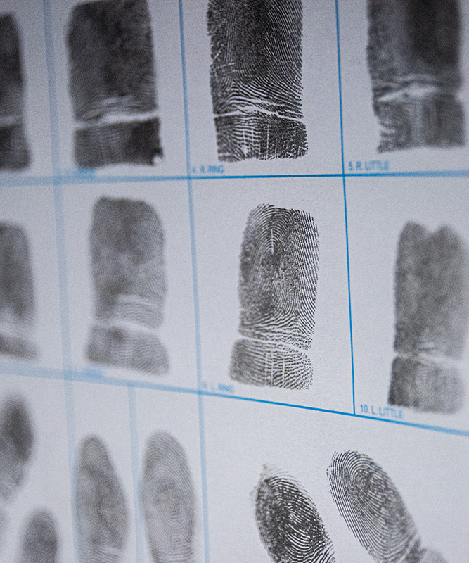A closeup image of fingerprints on a white sheet.